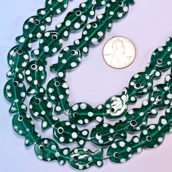 Fish-shaped jungle green glass beads with white dot pattern