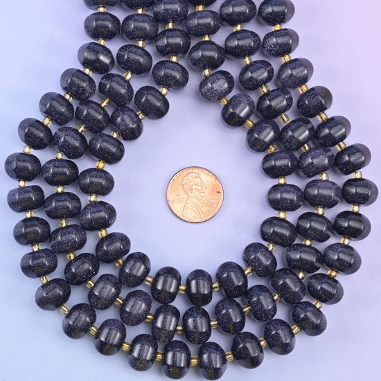 Blue Sandstone pumpkin bead loop framing a penny to show the bead scale