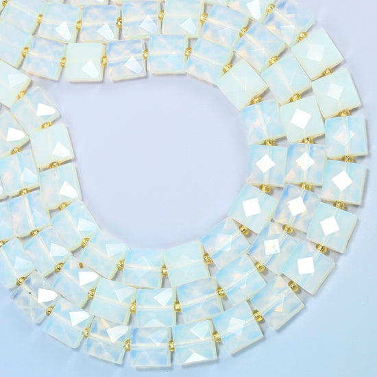 Opalite faceted flat square beads curved into an open loop, milky white beads with a soft blue glow