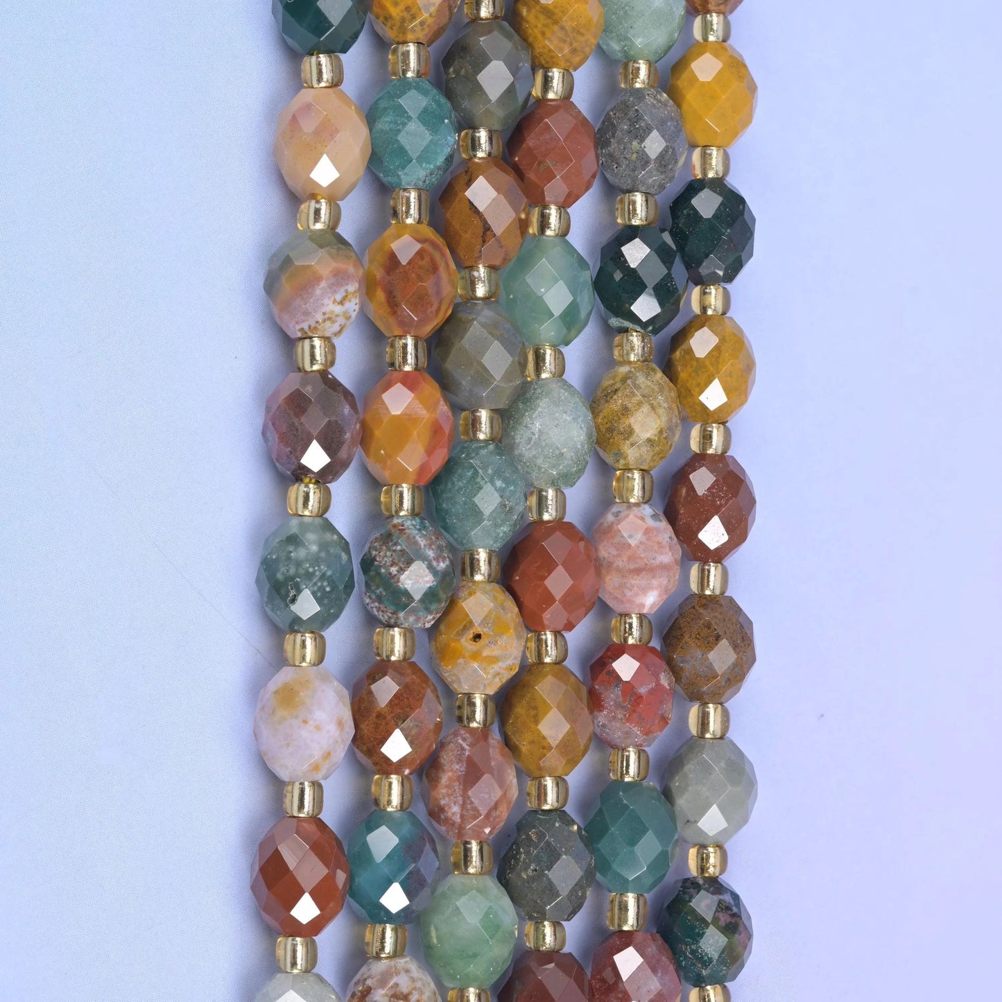 Faceted rice barrel cut ocean agate beads