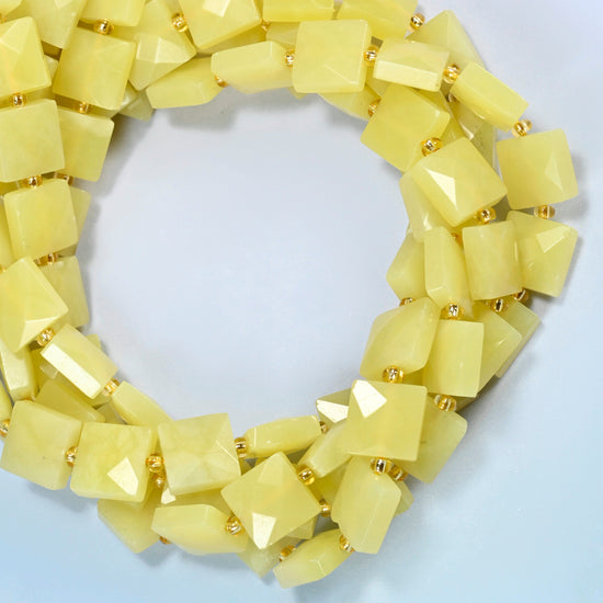 Lemon Jade faceted flat square beads coiled into overlapping loops, whole strands of soft lemon yellow stone