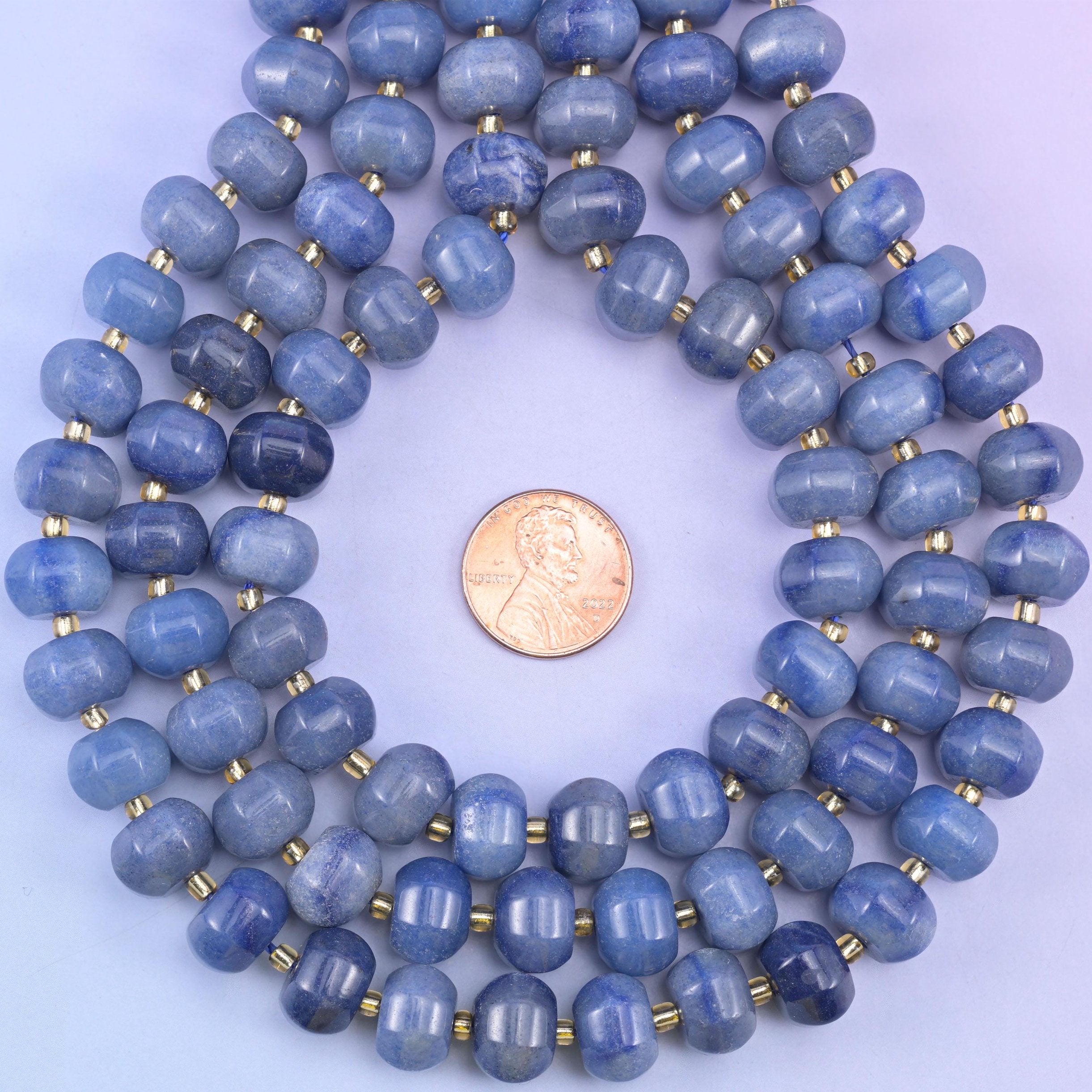 Penny centred inside a ring of coiled strands, giving a familiar reference for bead diameter