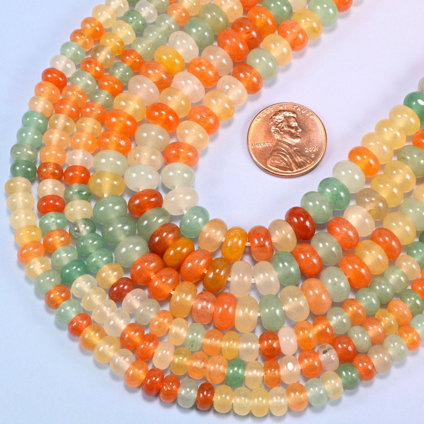 Gold Silk Jade gemstone rondelle beads in a wide U, each bead centre drilled with a 1.0mm to 1.2mm hole