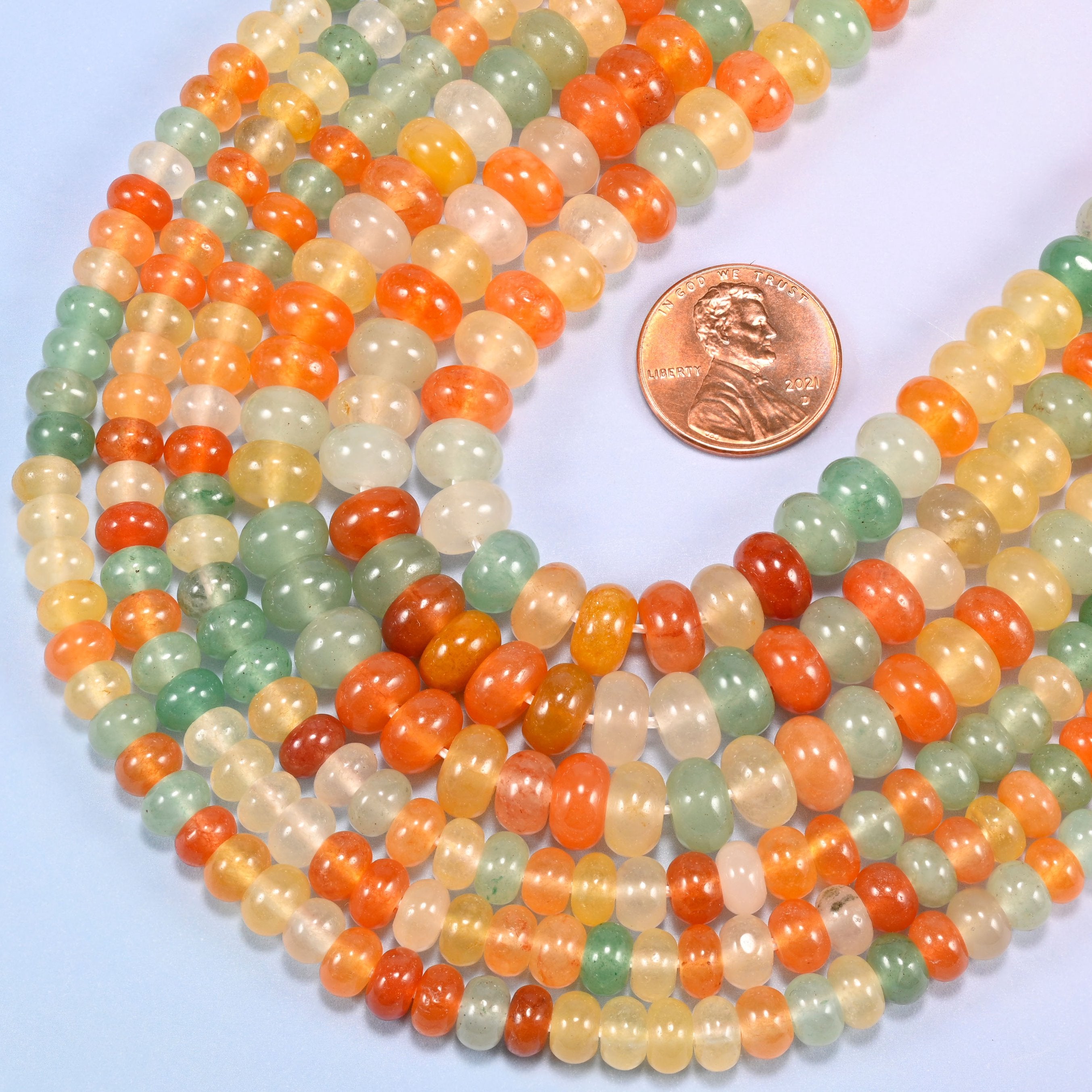 Gold Silk Jade gemstone rondelle beads in a wide U, each bead centre drilled with a 1.0mm to 1.2mm hole