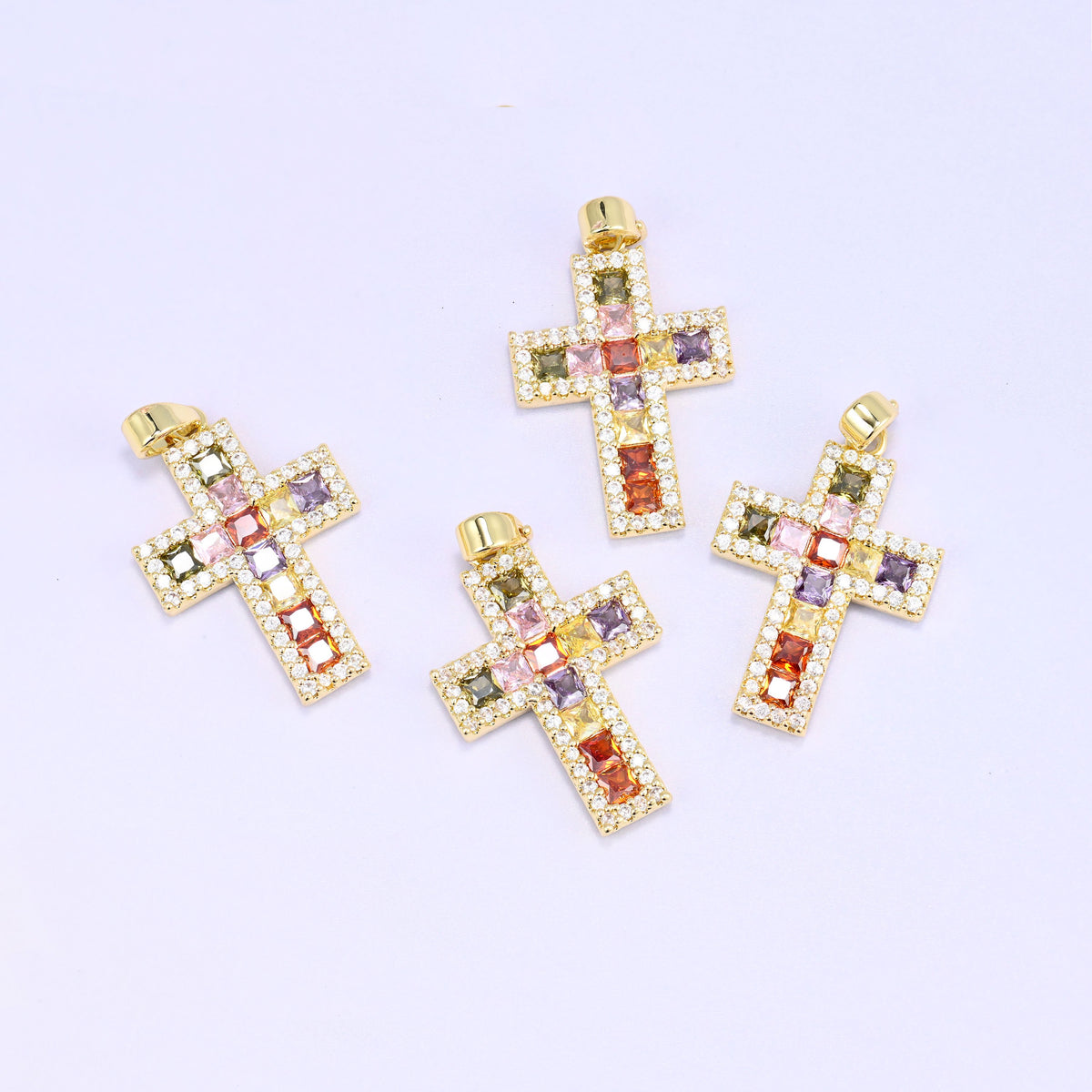Zirconia cross charms, five gold plated pendants scattered, each set with multicolour stones