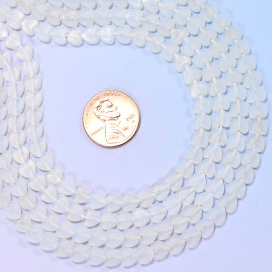 Matte Opalite Flat Heart Beads, milky translucent hearts with a faint cool blue-white glow