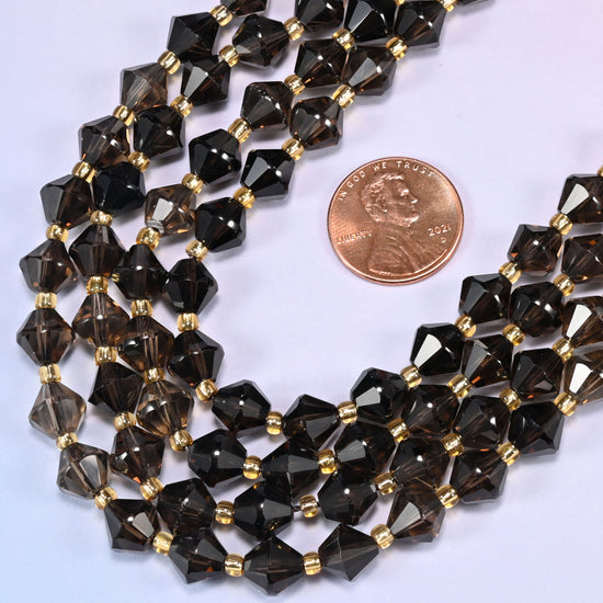 8mm Smoky Quartz faceted bicone beads coiled into a loose circle on a light lavender background.