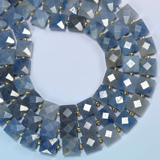 Natural blue aventurine faceted flat square beads curved into an open loop, denim blue and gray-blue beads