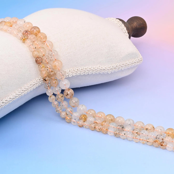 Gold Mica Biotite Smooth Round Beads with fine golden mica flakes.