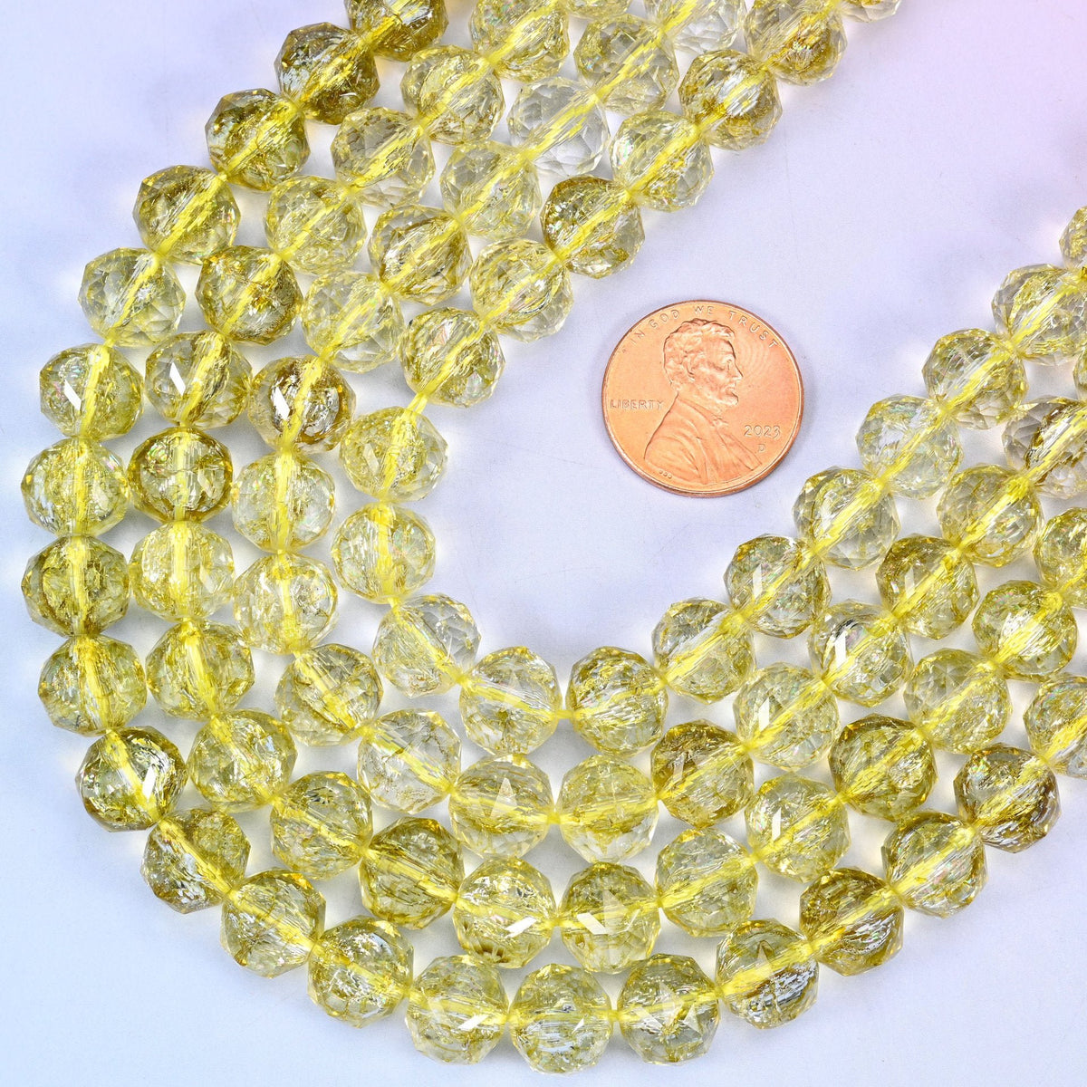 Faceted round cut transparent lemon yellow glass beads