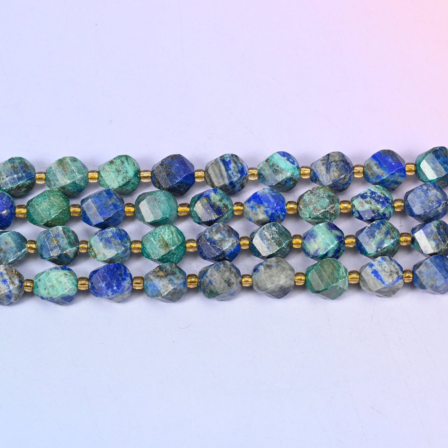 Phoenix Lapis lapis lazuli beads shifting from almost solid royal blue to mostly teal-green with blue veining