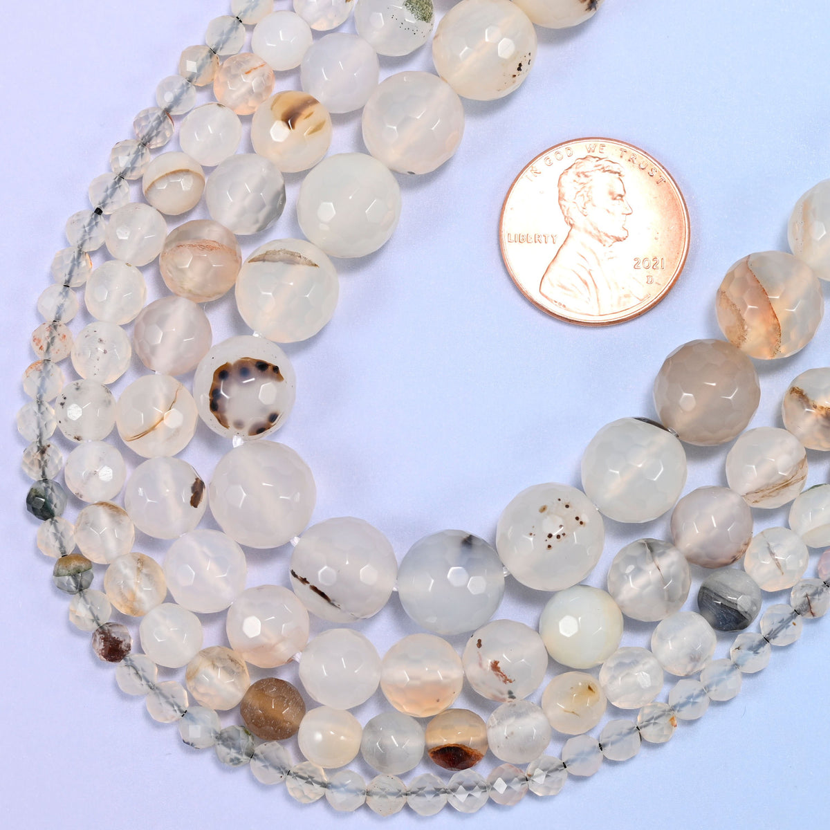 Faceted round cut black flower agate beads
