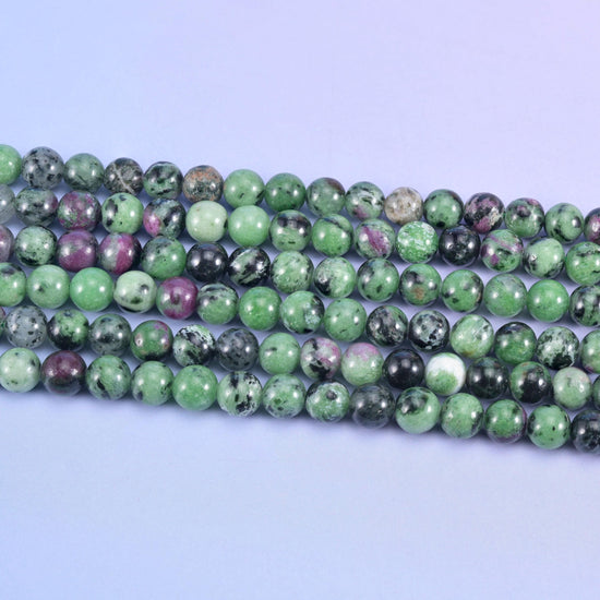 Ruby Zoisite smooth round beads, 15 inch strand