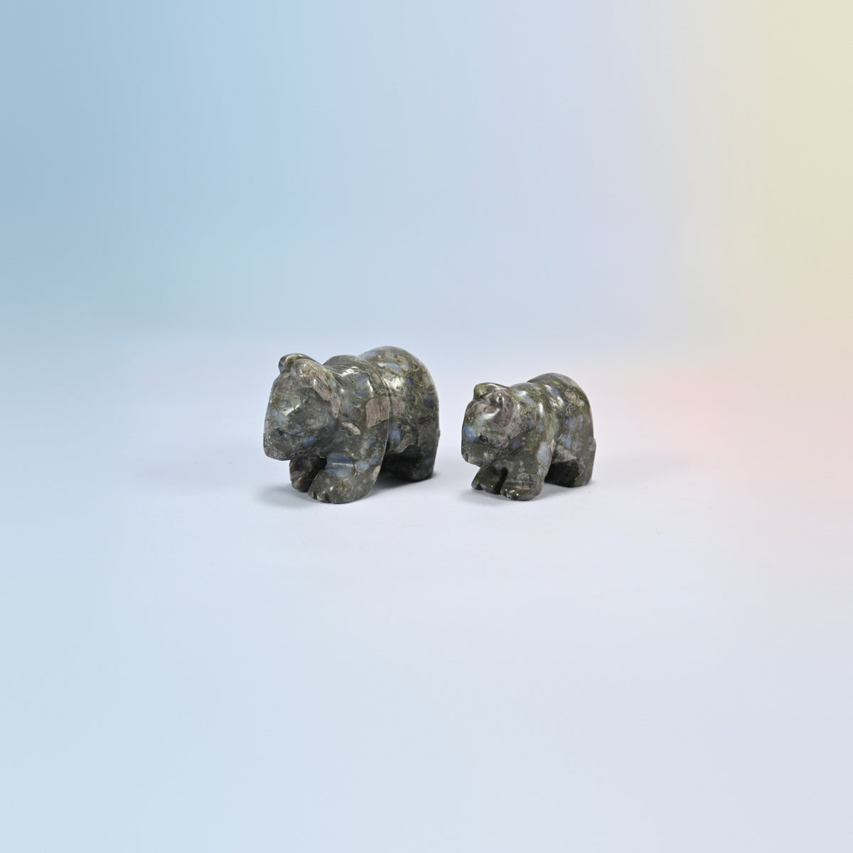 A 2 inch and a 1.5 inch blue labradorite bear crystal carving, gray natural stone with blue flash