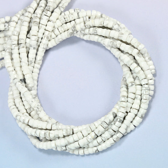 White howlite faceted heishi disc beads coiled into overlapping loops, whole strands of white stone