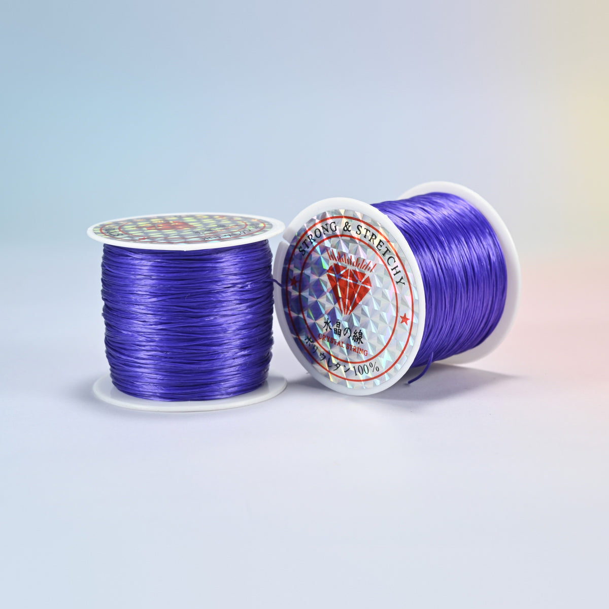 Two rolls of blue purple 0.7-0.8mm elastic stretch string, glossy polyurethane bead cord with a holographic label