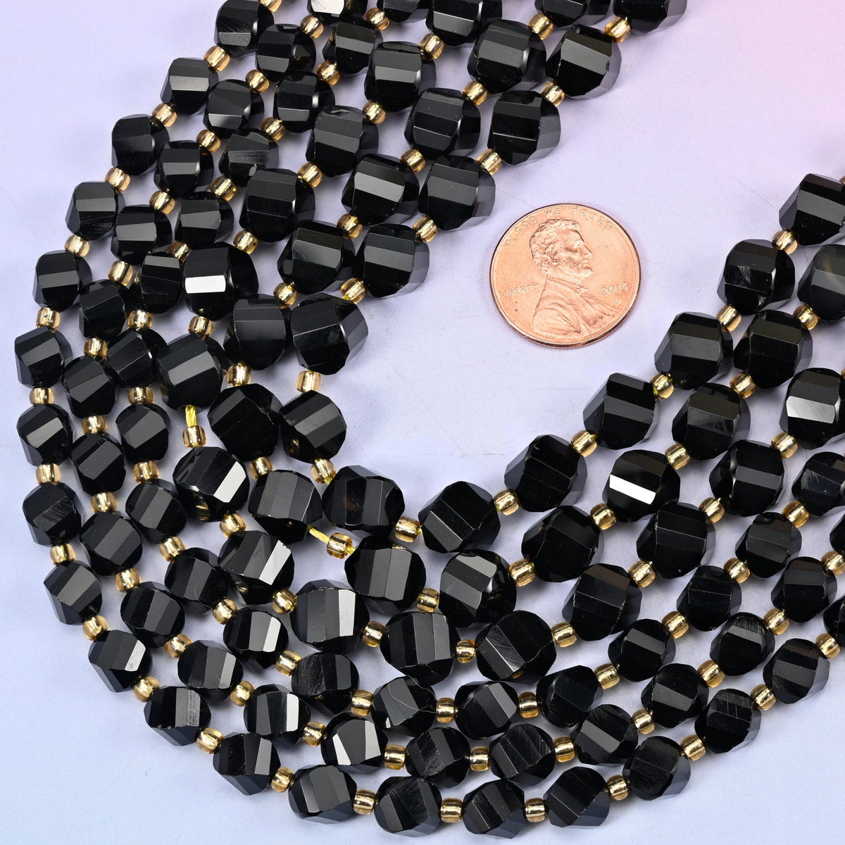 Faceted spiral twist cut black onyx beads