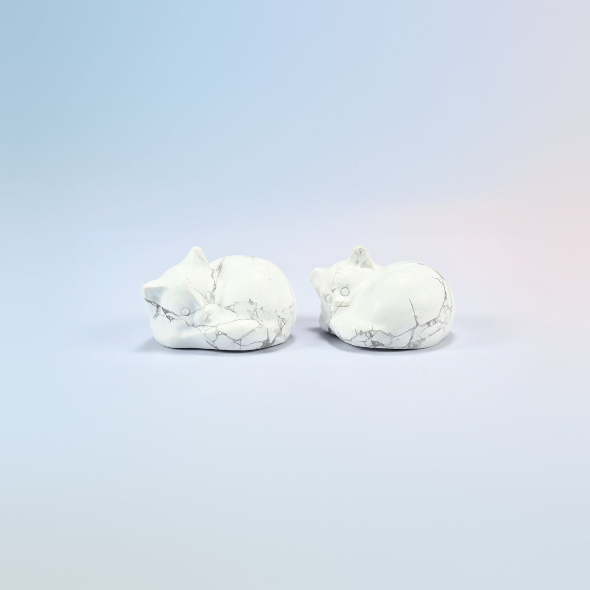 Two natural white howlite sleeping cat crystal carvings, 1.5 inch, white with gray veining
