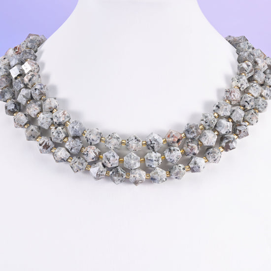 Eight-sided faceted gemstone beads as accent beads in layered designs.
