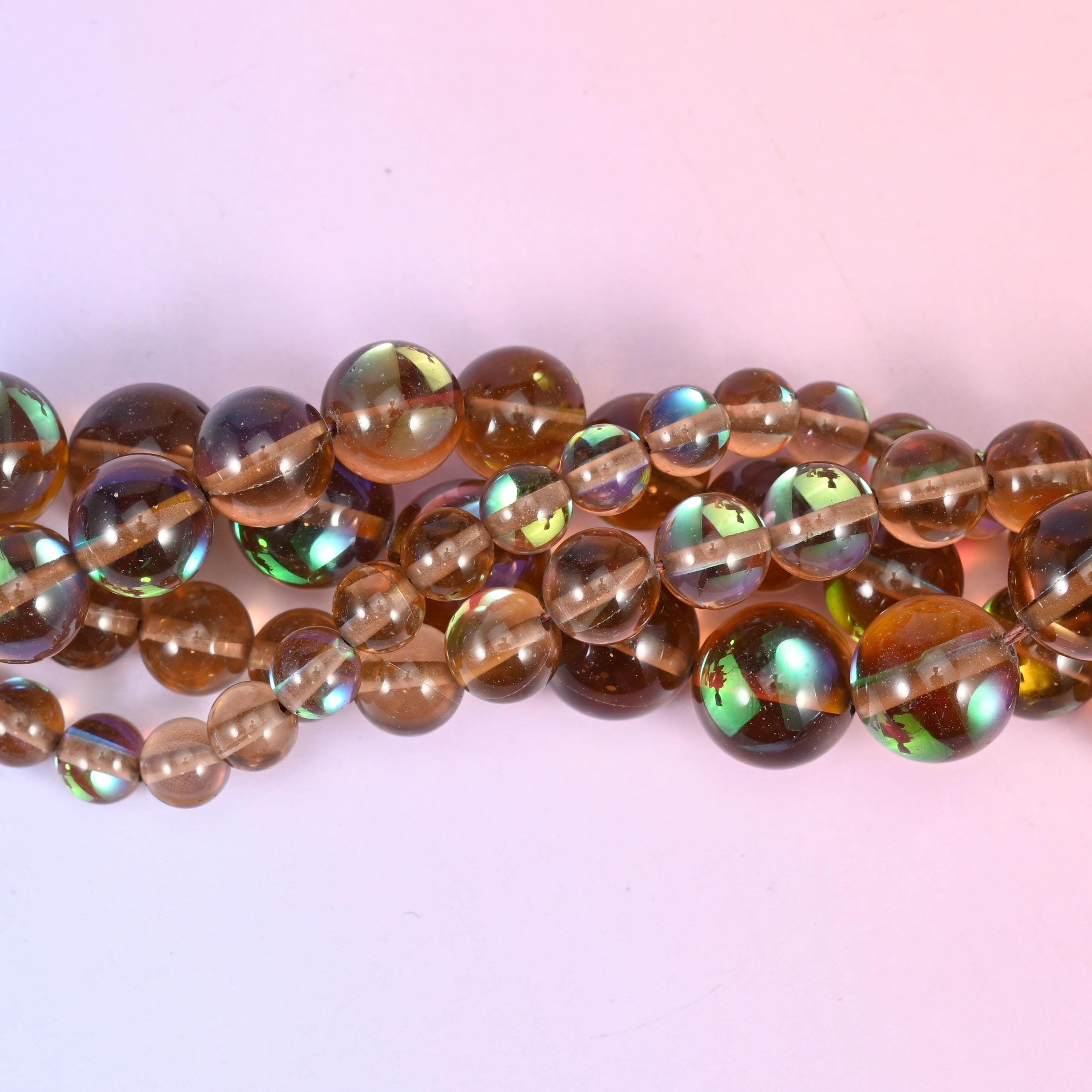 Clear smoky brown glass with a peacock-green and gold iridescent panel set into one side, fully polished
