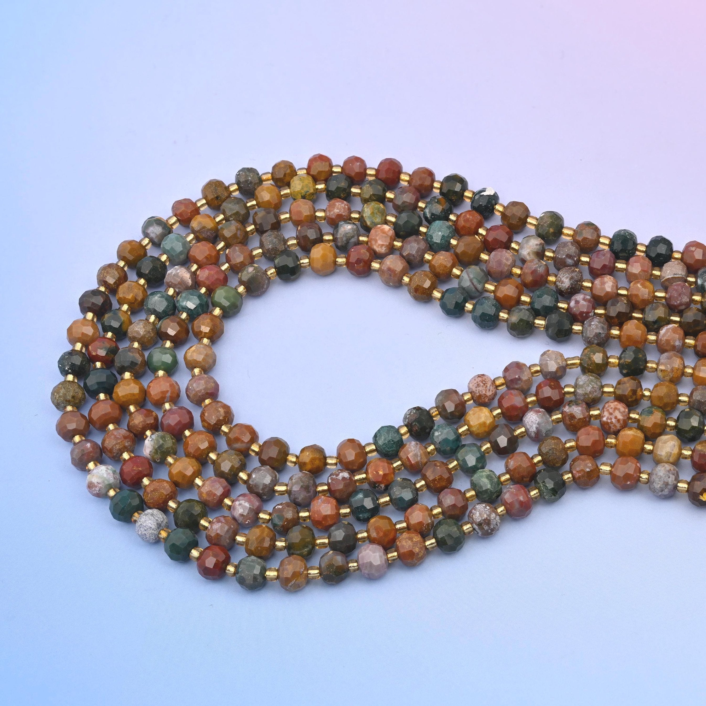 Ocean agate faceted rondelle beads in ochre, rust brown, sea-green teal, grey, mauve and cream