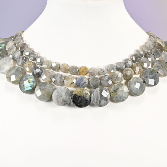 Gray Labradorite faceted coin beads layered as a collar, several strands showing the 8mm, 10mm and 16mm sizes