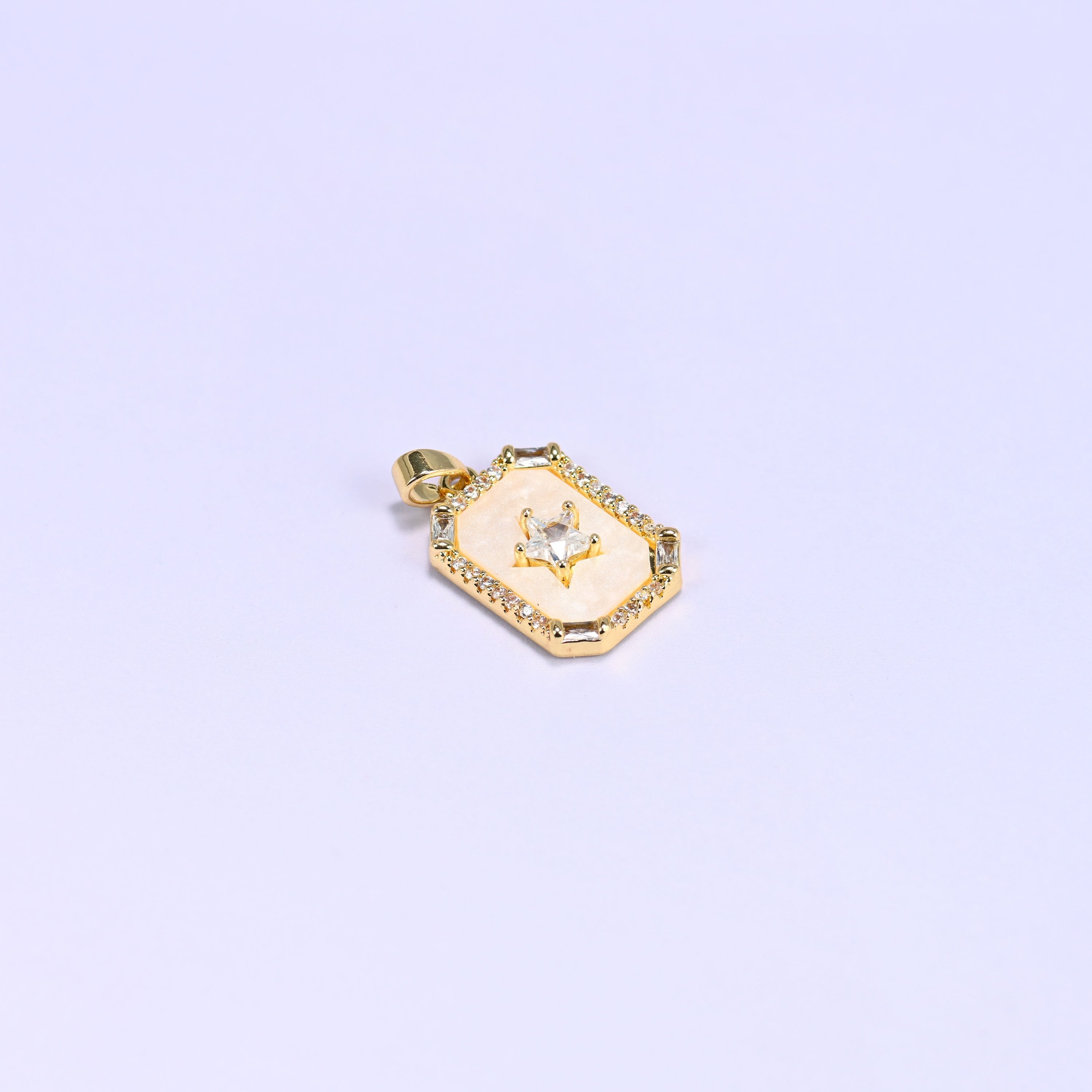 Star frame charm with a baguette and round zircon border
