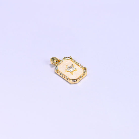 Star frame charm with a baguette and round zircon border