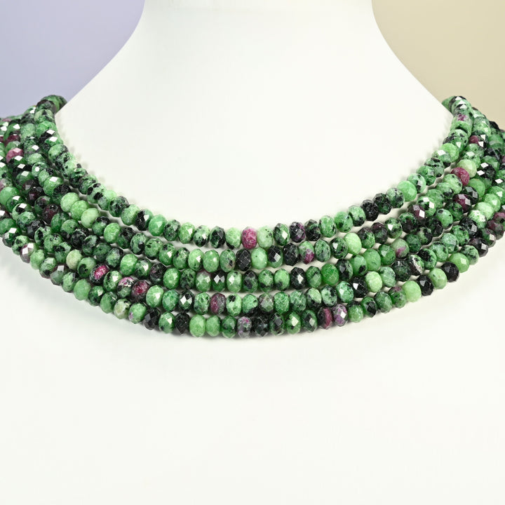 Ruby Zoisite gemstone rondelle beads 4x6mm shown on a white neck display as a layered necklace