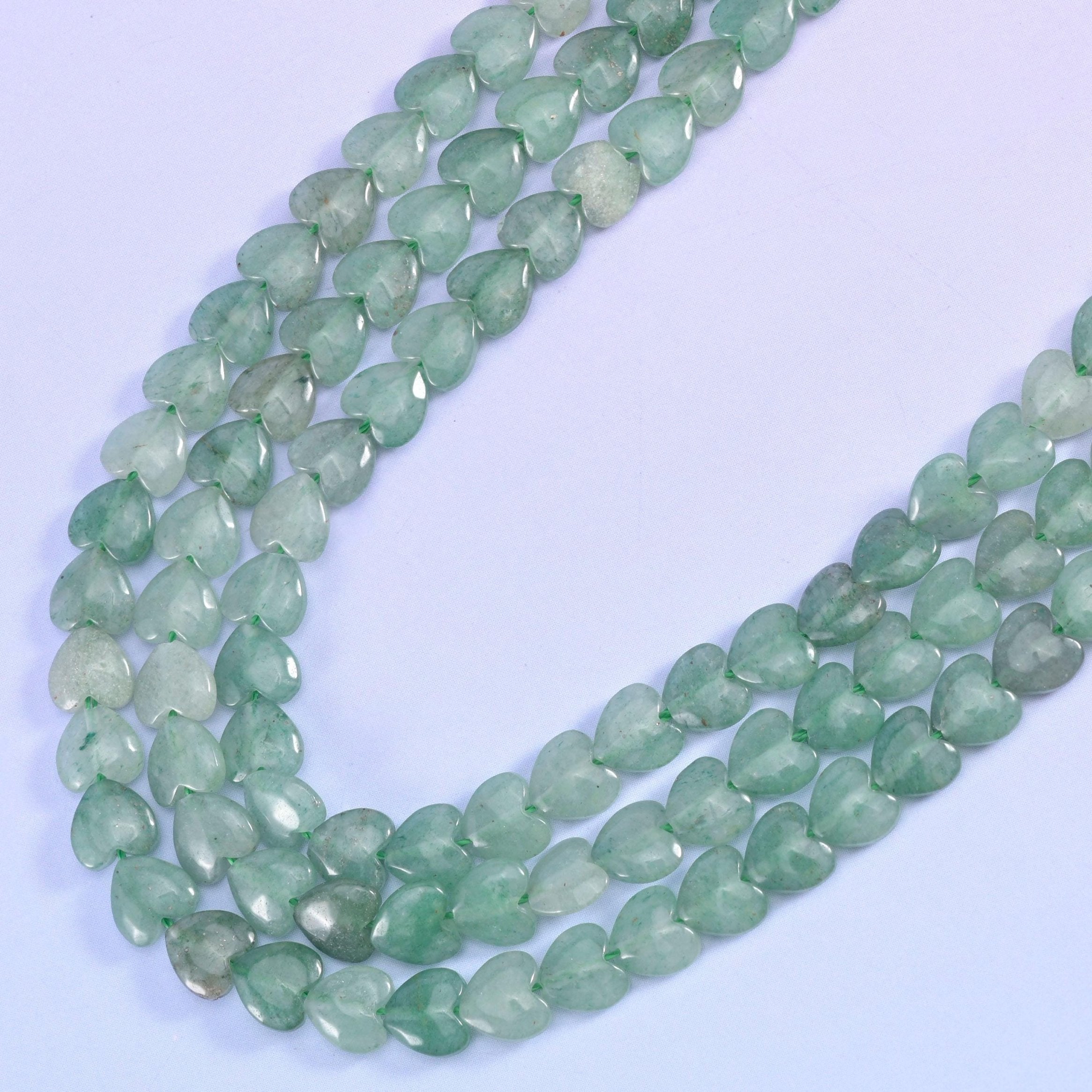Green aventurine heart beads, approximately 70 beads per strand