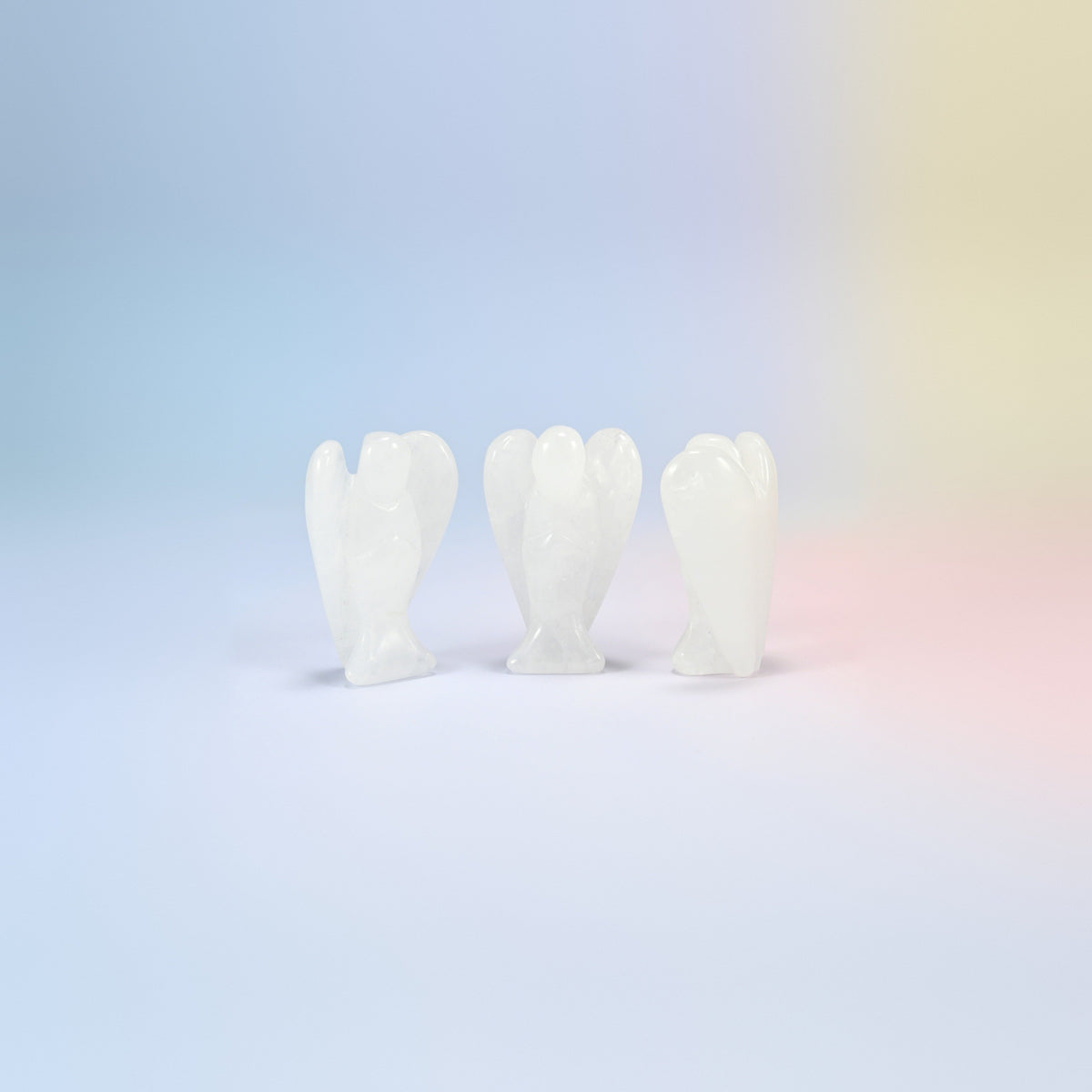 Three natural clear quartz guardian angel carvings, icy white, 2 inch