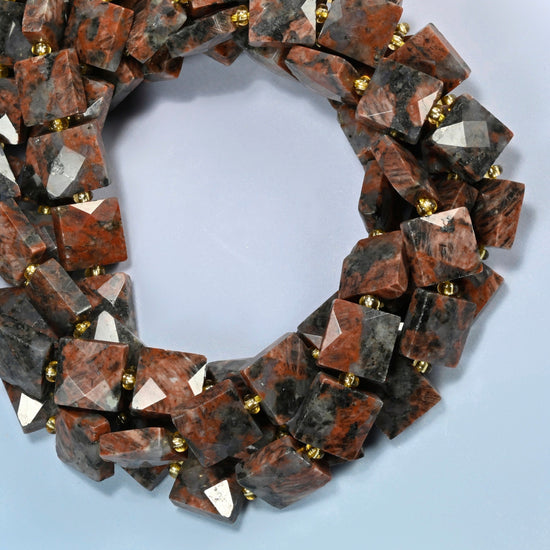 Natural red sesame jasper faceted flat square beads coiled into overlapping loops, whole strands of speckled brick red stone