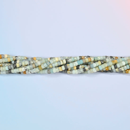Strands of multi-color amazonite faceted heishi disc beads twisted together in a horizontal row
