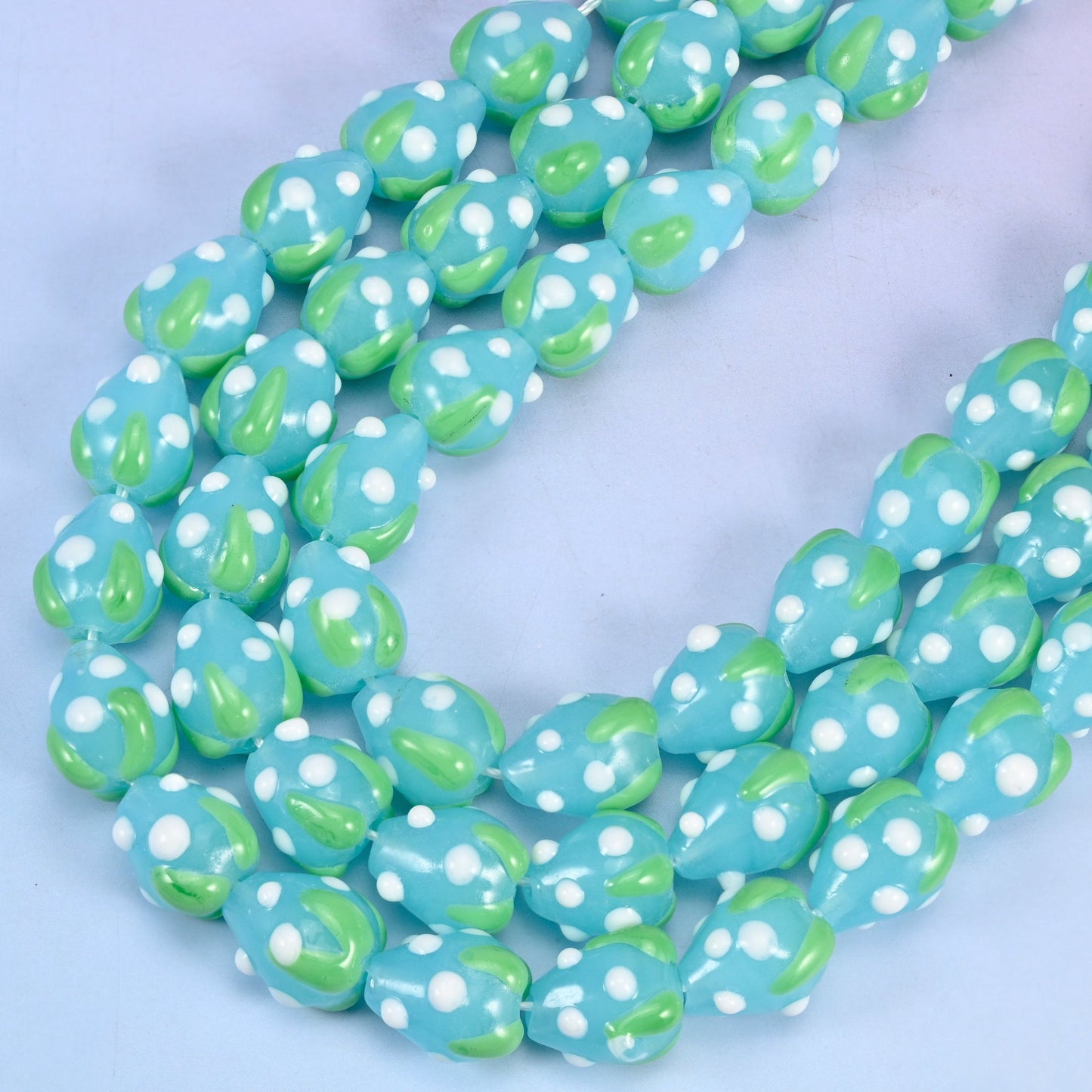 Blue White Dots Strawberry Glass Beads 15.5x12mm in sky blue with white dots and a green leaf top
