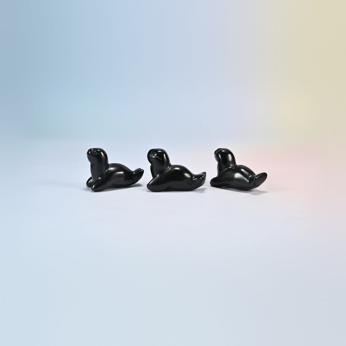 Three black obsidian sea lion crystal carvings, 1.5 inch, glossy black natural stone