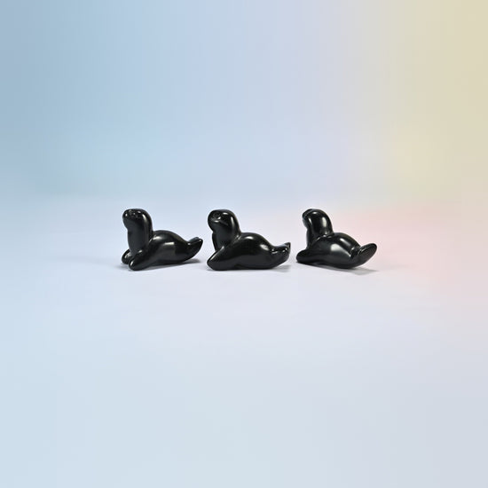 Three black obsidian sea lion crystal carvings, 1.5 inch, glossy black natural stone
