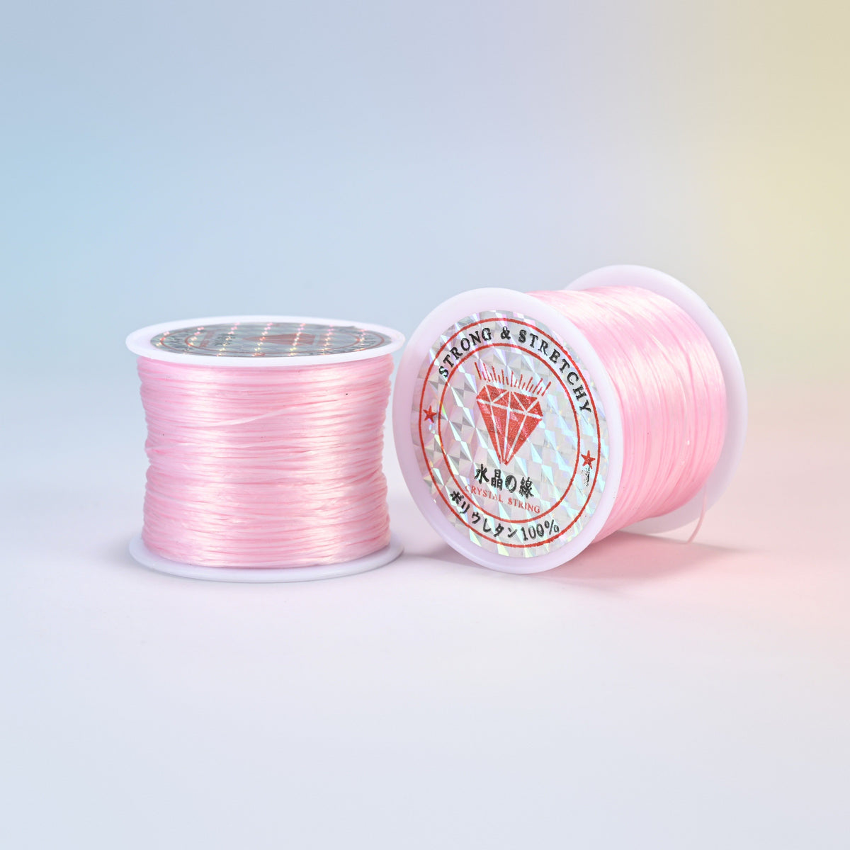 Two rolls of light pink 0.7-0.8mm elastic stretch string, glossy polyurethane bead cord with a holographic label