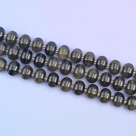 Gold obsidian beads with a shimmering golden sheen over glossy black