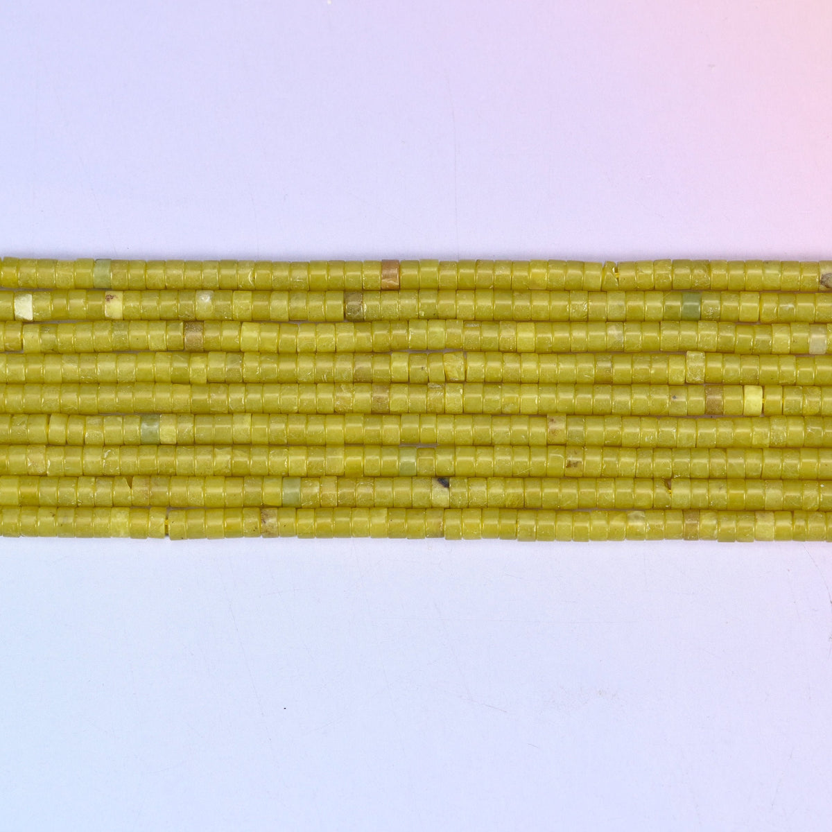 Lemon Jade Smooth Heishi Disc Beads in bright yellow-green