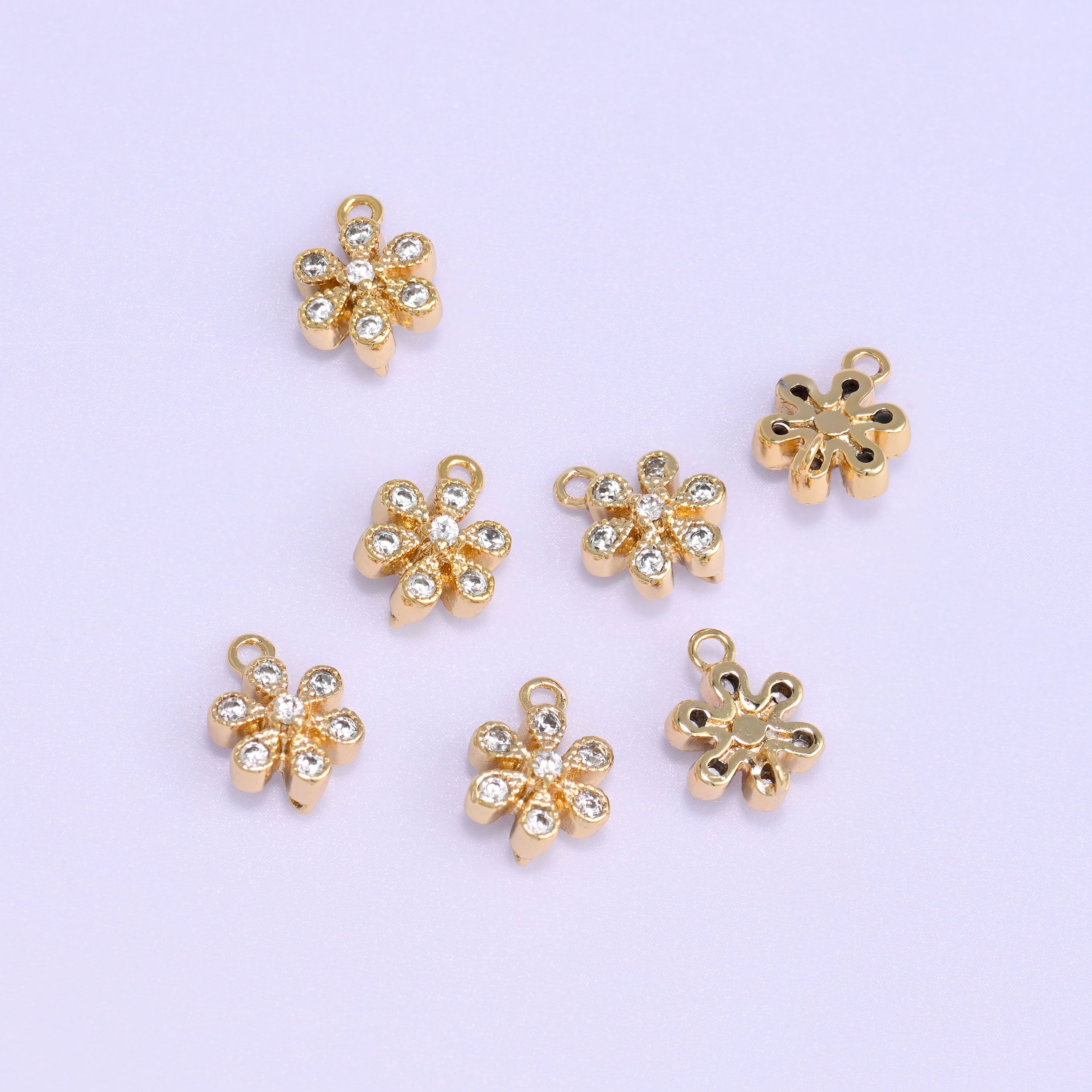 Small gold charms, eight gold plated flower charms with fronts and backs shown
