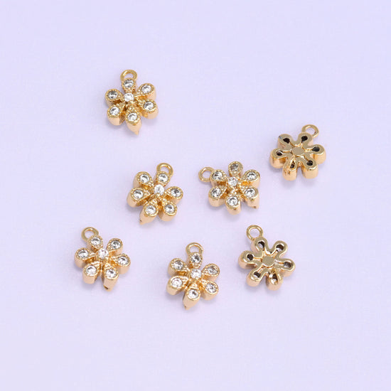 Small gold charms, eight gold plated flower charms with fronts and backs shown