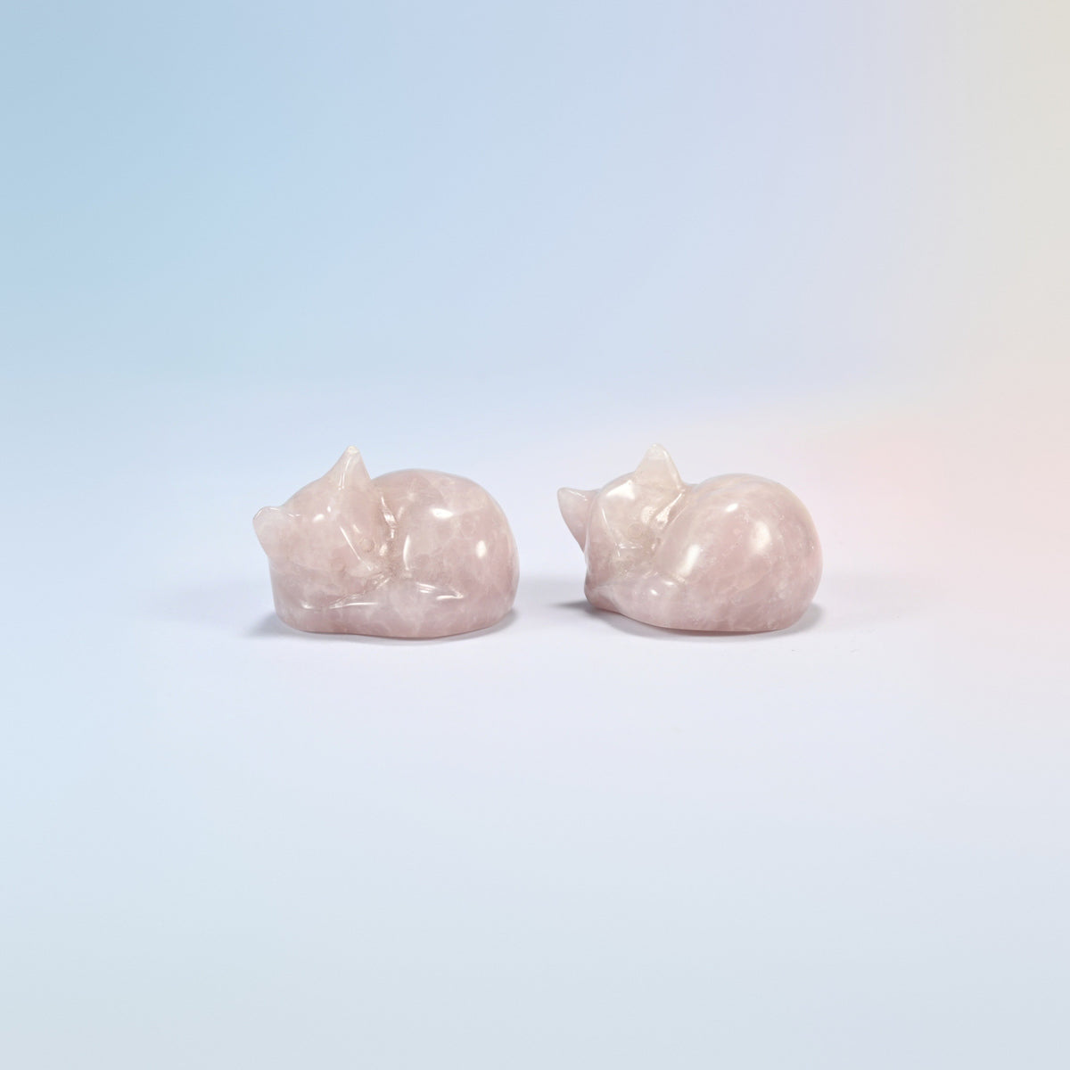 Two natural rose quartz sleeping cat crystal carvings, 1.5 inch, light pink