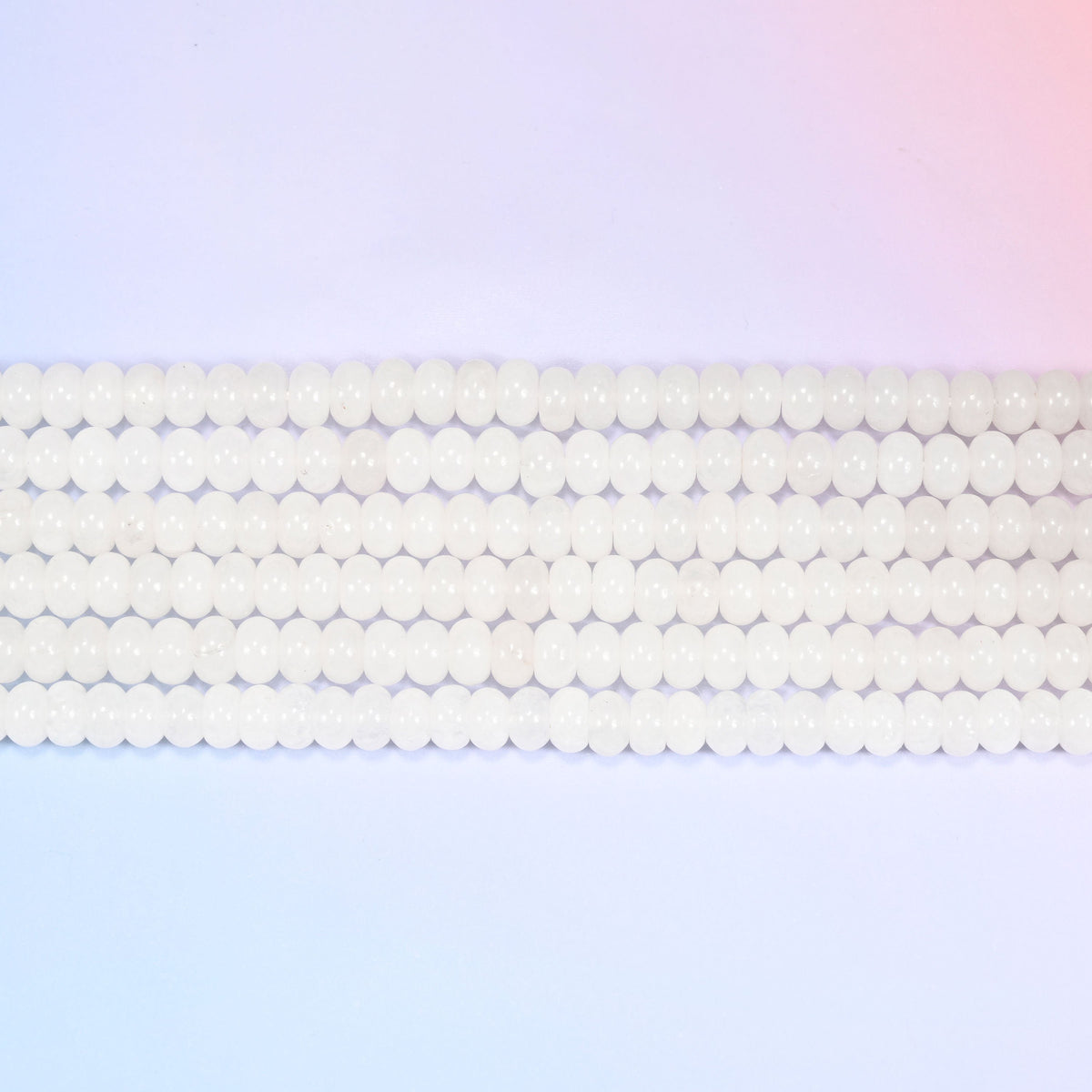 Natural White Jade Rondelle Beads in a smooth, milky white tone.