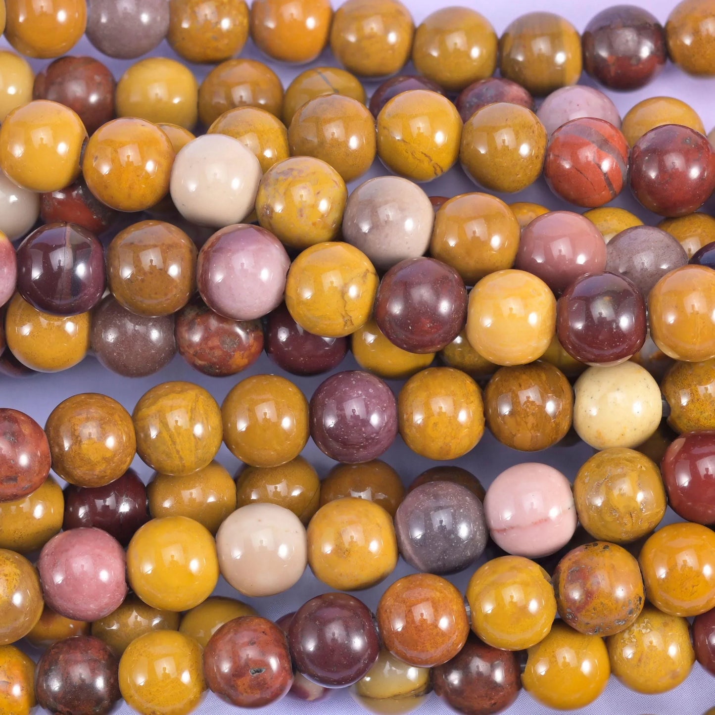 Smooth round cut mookaite jasper beads