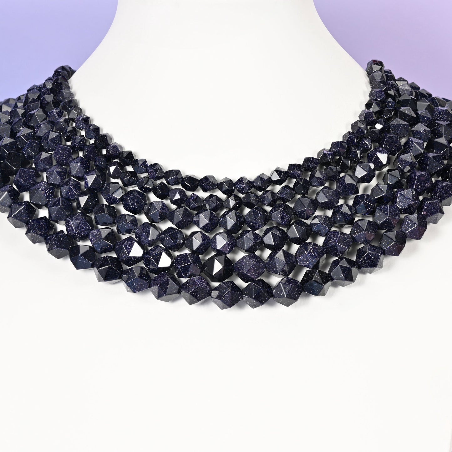 Blue Sandstone diamond star cut beads shown as a layered multi-strand collar on a white bust form