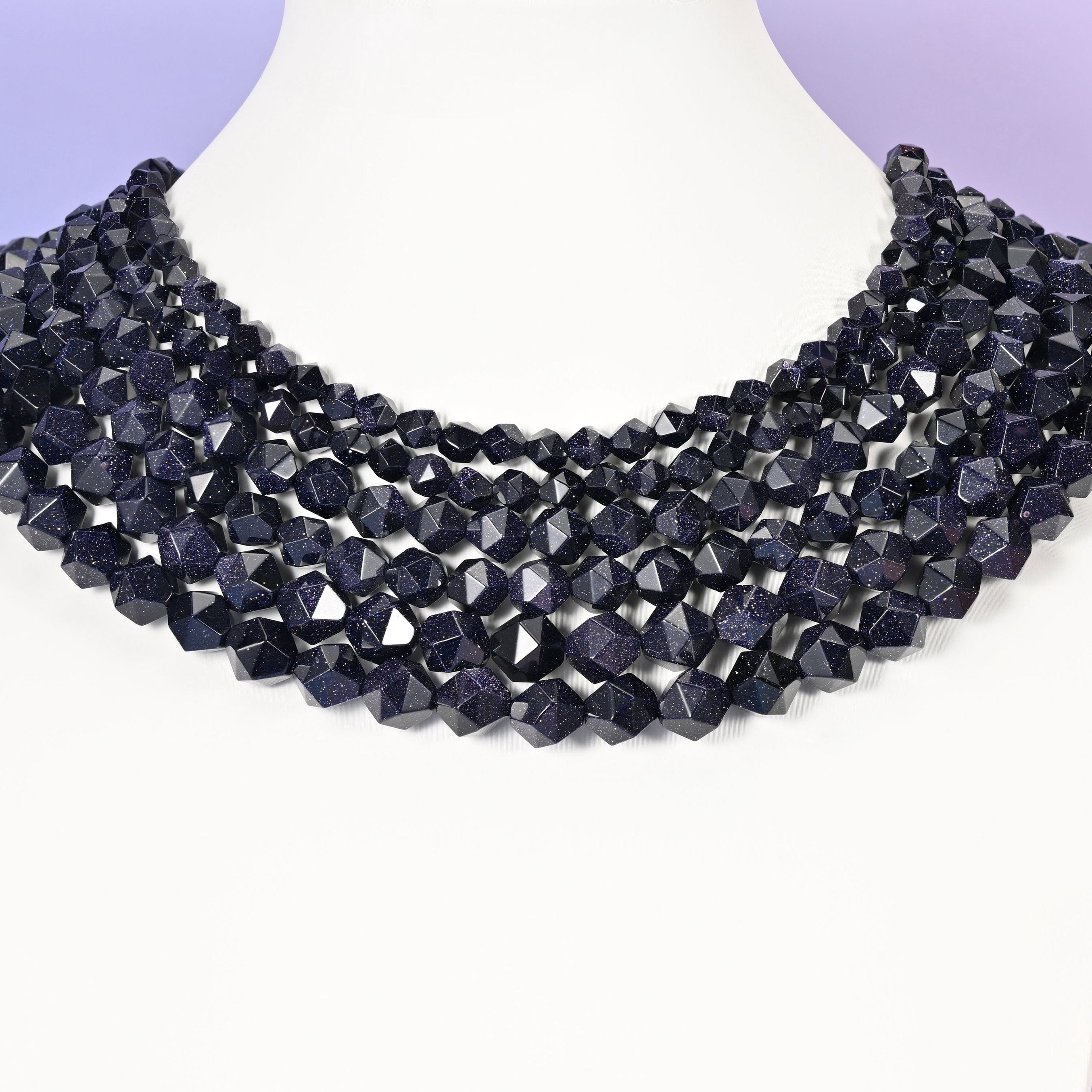 Blue Sandstone diamond star cut beads shown as a layered multi-strand collar on a white bust form