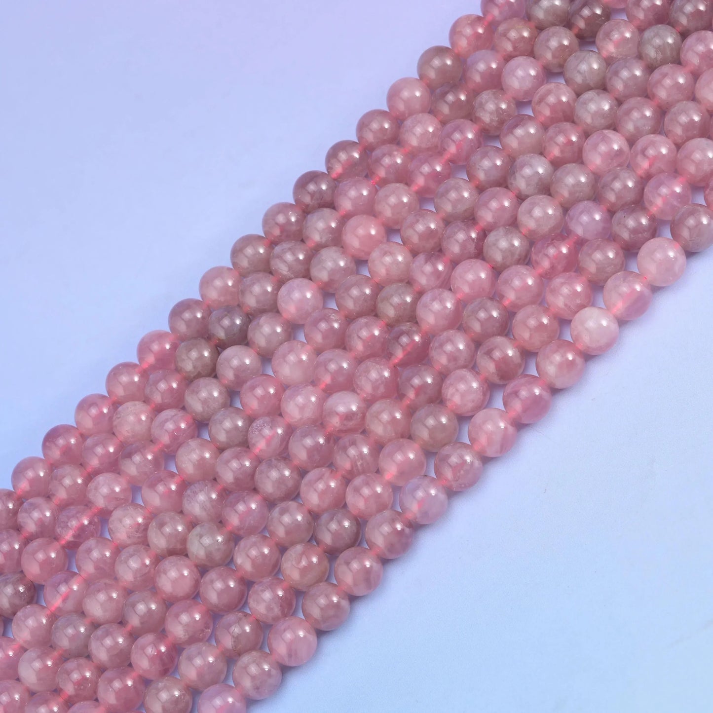 Madagascar Purple Rose Quartz in dusty mauve pink shading to lilac.