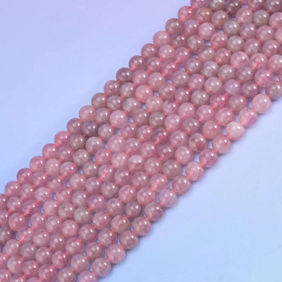 Madagascar Purple Rose Quartz in dusty mauve pink shading to lilac.