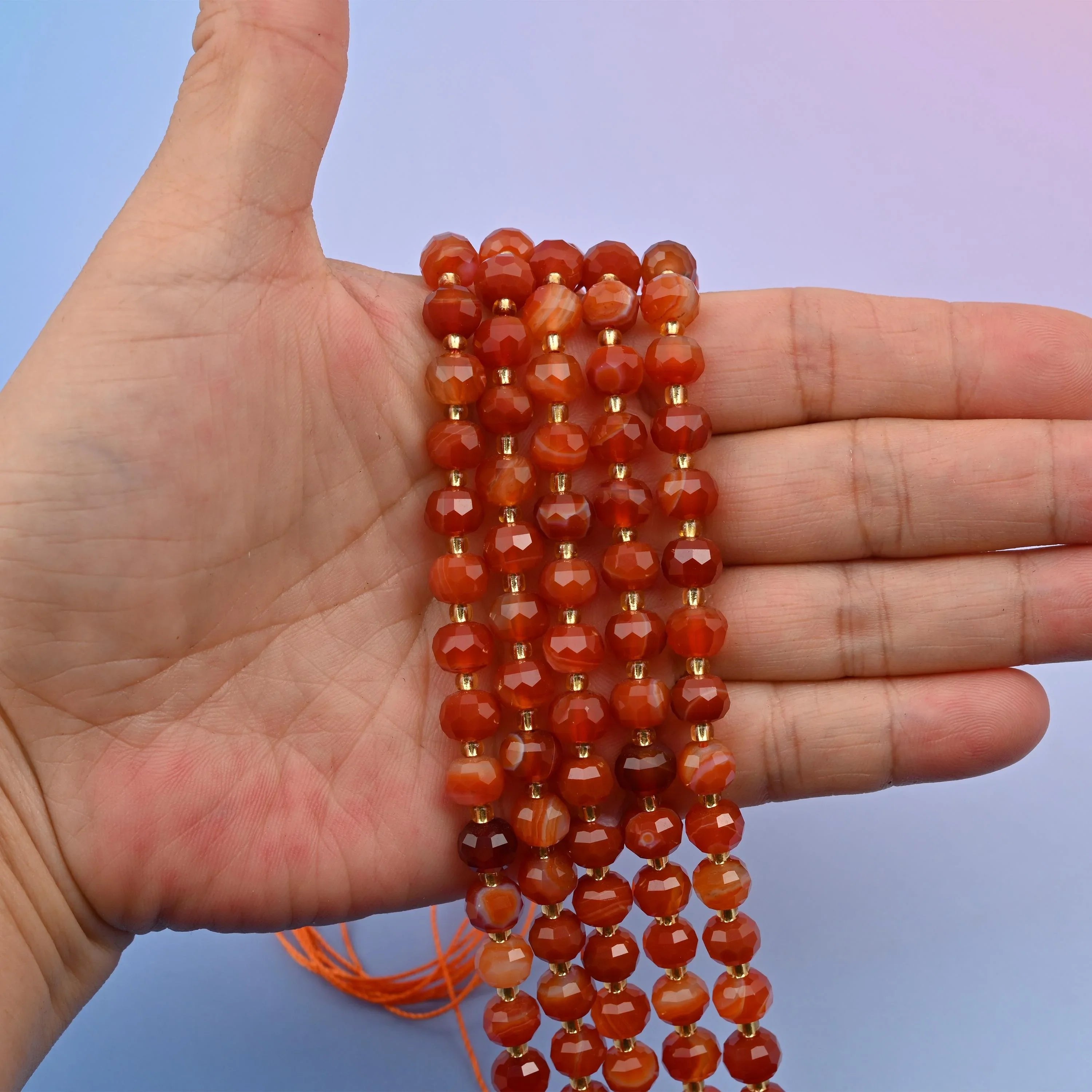 Red Strip Agate beads, faceted rondelle shape, 6x8mm with a polished finish.