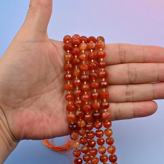 Red Strip Agate beads, faceted rondelle shape, 6x8mm with a polished finish.